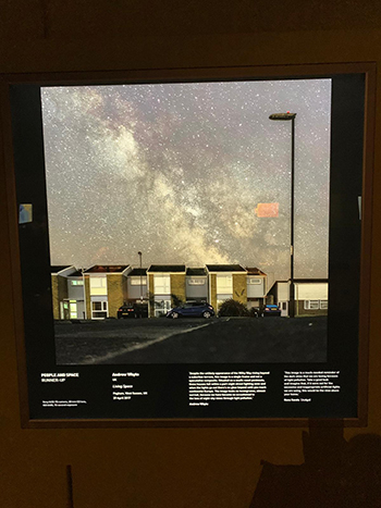 A photo of the Milky Way above a row of houses