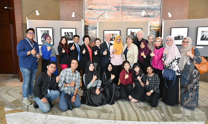 Professor Nigel Weatherill and Mike McCartney with Malaysian Graduates