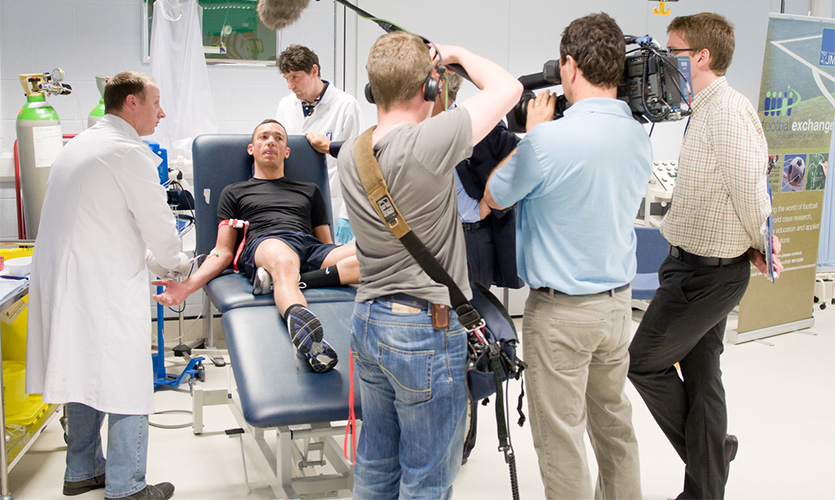 Graeme and team with jockey Frankie Dettori filmed by TV crew at LJMU.