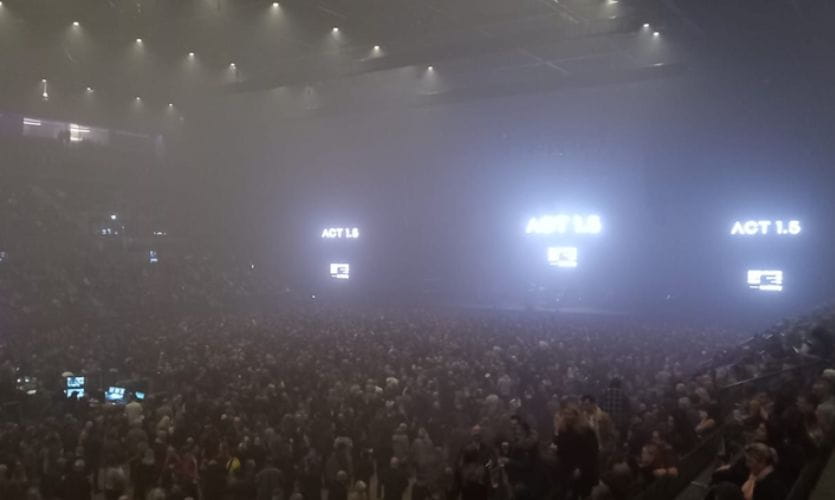 Musical band Massive Attack seen from a distance on stage in a crowed indoor arena in Liverpool