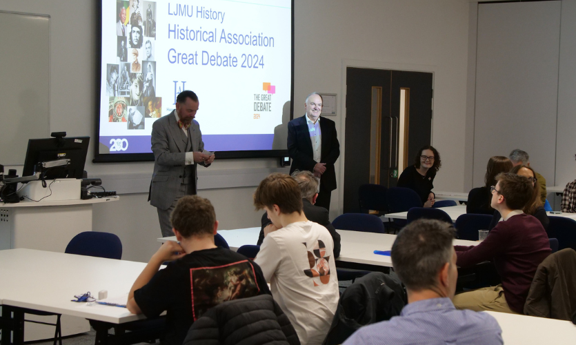 David Clampin and Mark Power talking to a classroom full of people 